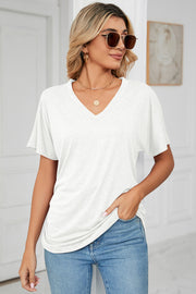 White V-neck tee with short dolman sleeves and subtle drape-front ruching.