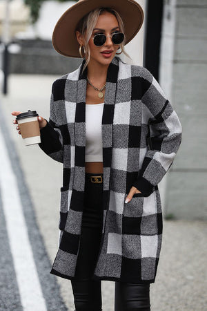 Oversized black and white checkerboard knit duster coat with open front and pockets