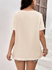 Cream raglan sleeve tee with fringed hem and neckline detail.
