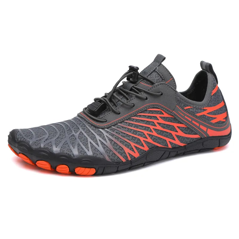Gray mesh trail runners with orange accents and quick-lace closure.
