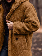 Brown teddy bear longline coat with hood and button closure.