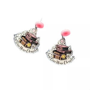 Book stack acrylic drop earrings in blush pink with "Just One More Chapter" text.