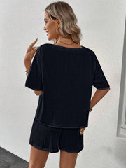 Black textured gauze lounge set with short sleeves and shorts
