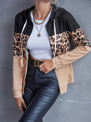Colorblock leopard zip-up hoodie with black, tan, and leopard print panels.