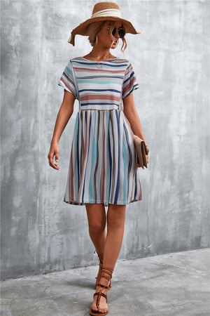 Striped yoke-seam trapeze dress with short sleeves and a trapeze skirt in multi-color stripes.