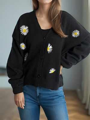 Black acrylic oversized knit cardigan with embroidered daisies, V-neck, button front.