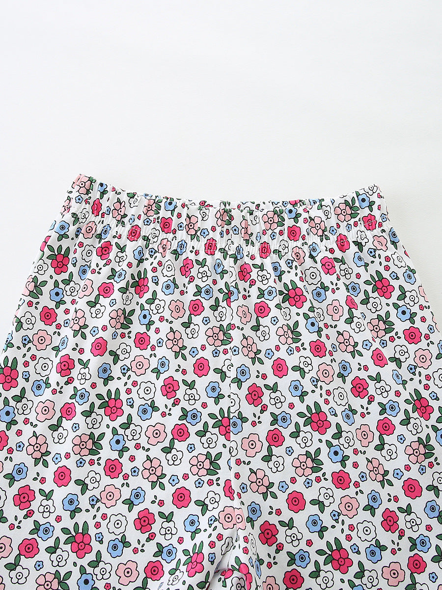 Toddler girls' bikini bottoms with elastic waist and allover floral print.