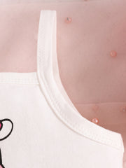 White cotton baby tank top with cow print detail and pink tulle overlay.
