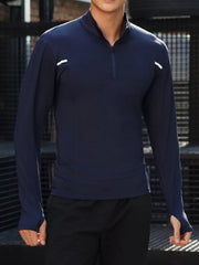 Men's royal blue quarter-zip long sleeve active t-shirt with thumbholes and reflective details.