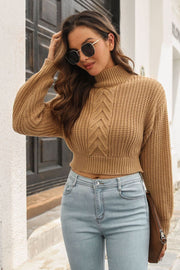 Camel chevron cable knit cropped turtleneck sweater with ribbed details.