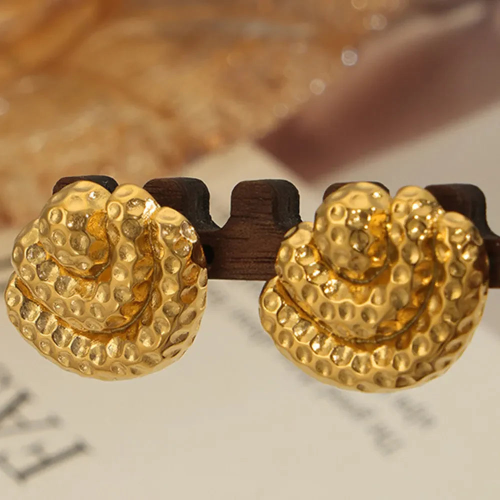 Textured gold shell stud earrings with hammered finish