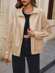 Khaki faux leather bomber jacket with a zip front and collared neckline.