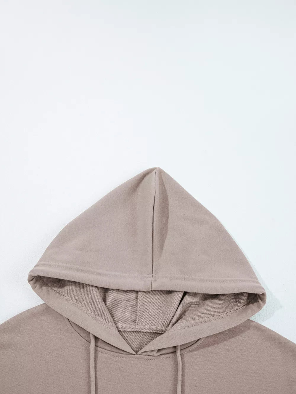 Relaxed fit cotton hoodie in taupe with drawstring hood and kangaroo pocket detail.