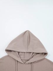 Relaxed fit cotton hoodie in taupe with drawstring hood and kangaroo pocket detail.