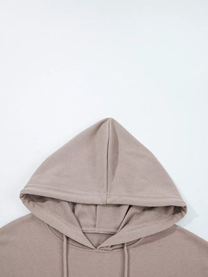 Relaxed fit cotton hoodie in taupe with drawstring hood and kangaroo pocket detail.