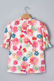 Vibrant floral print cotton blend shirt with ruched short sleeves and ruffled neckline.