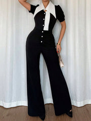 Button-down wide leg jumpsuit with puff sleeves and a white collar and placket.