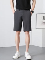 Men's dark gray chino shorts with a relaxed fit and side pockets.