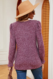Ribbed knit blouse in Red-Violet with puff sleeves and ruffled cuffs.