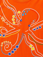 Orange cotton crew-neck t-shirt with a playful white outline octopus graphic and colorful polka dot accents.