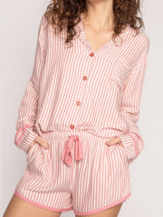 Striped pajama set in pale blush with contrast trim, collared shirt and drawstring shorts.