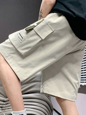 Men's lightweight cargo shorts in apricot with drawstring and utility loop detail.