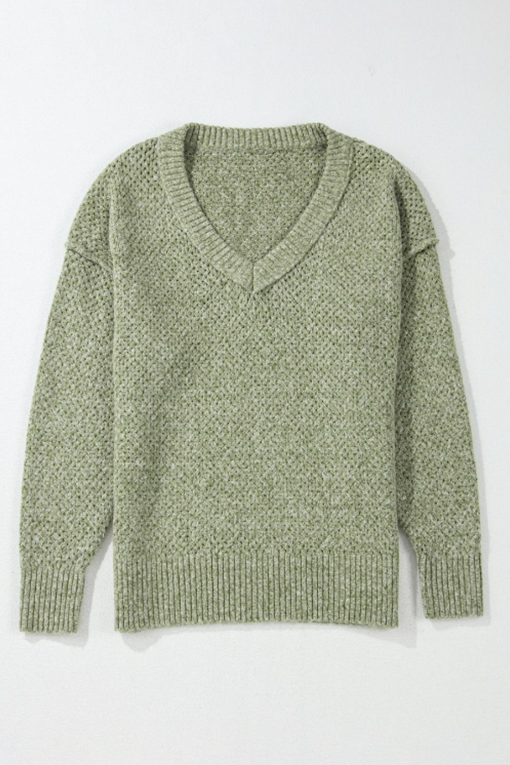 Open-knit slouchy V-neck sweater in matcha green with ribbed cuffs and hem.