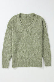 Open-knit slouchy V-neck sweater in matcha green with ribbed cuffs and hem.