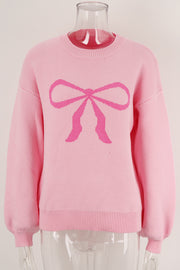 Blush pink acrylic sweater with a graphic pink bow intarsia pattern and crew neck.