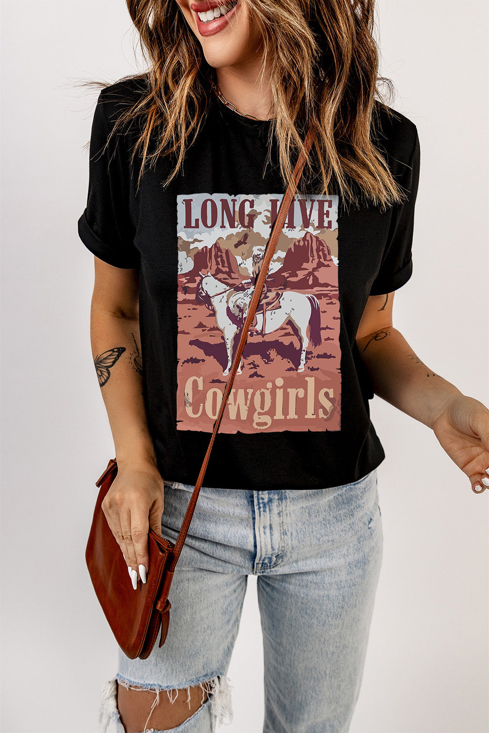 Black graphic tee with a desert horse and cowgirl scene, "Long Live Cowgirls" text.