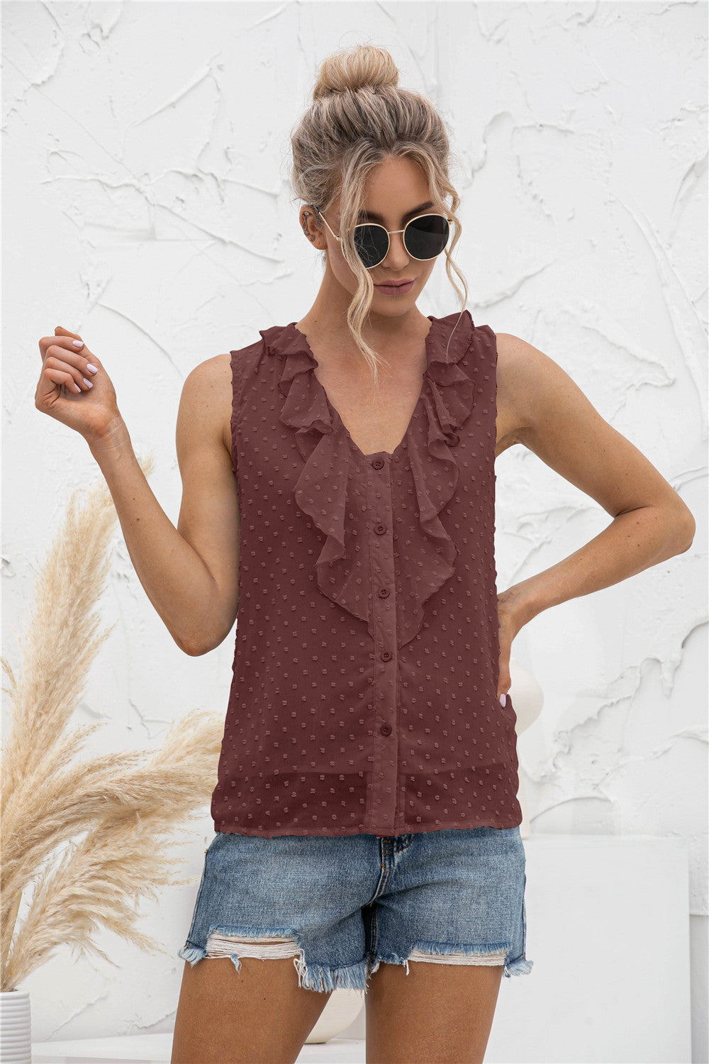 Brown textured ruffle front sleeveless blouse with button detail