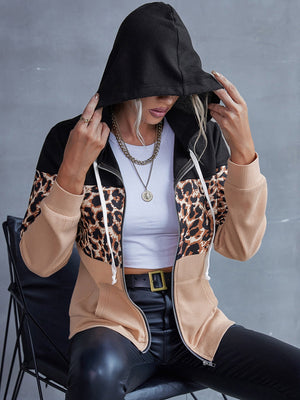 Colorblock leopard print zip-up hoodie with black hood and sleeves.