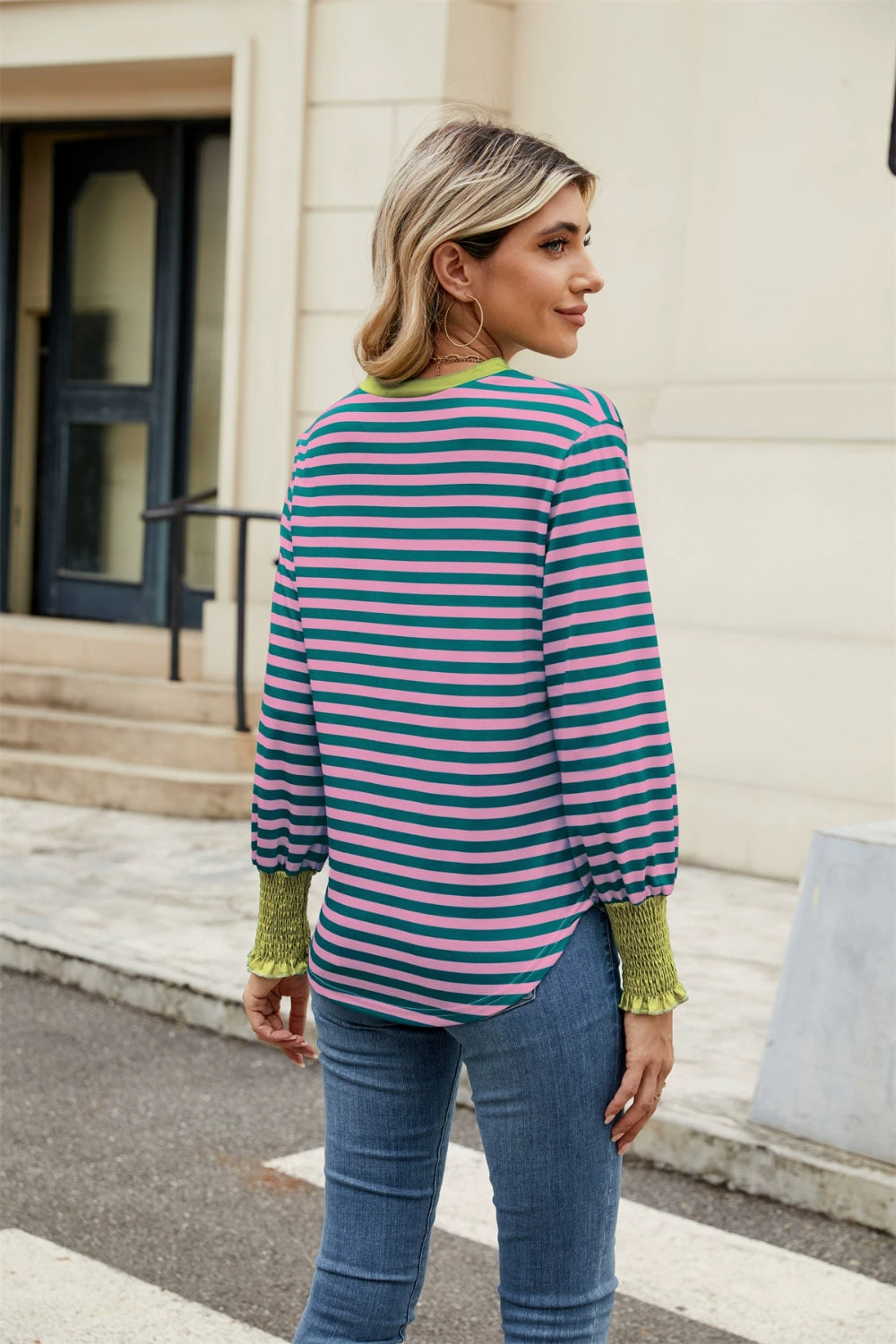 Striped long sleeve blouse with pink and teal stripes, green neckline and cuffs