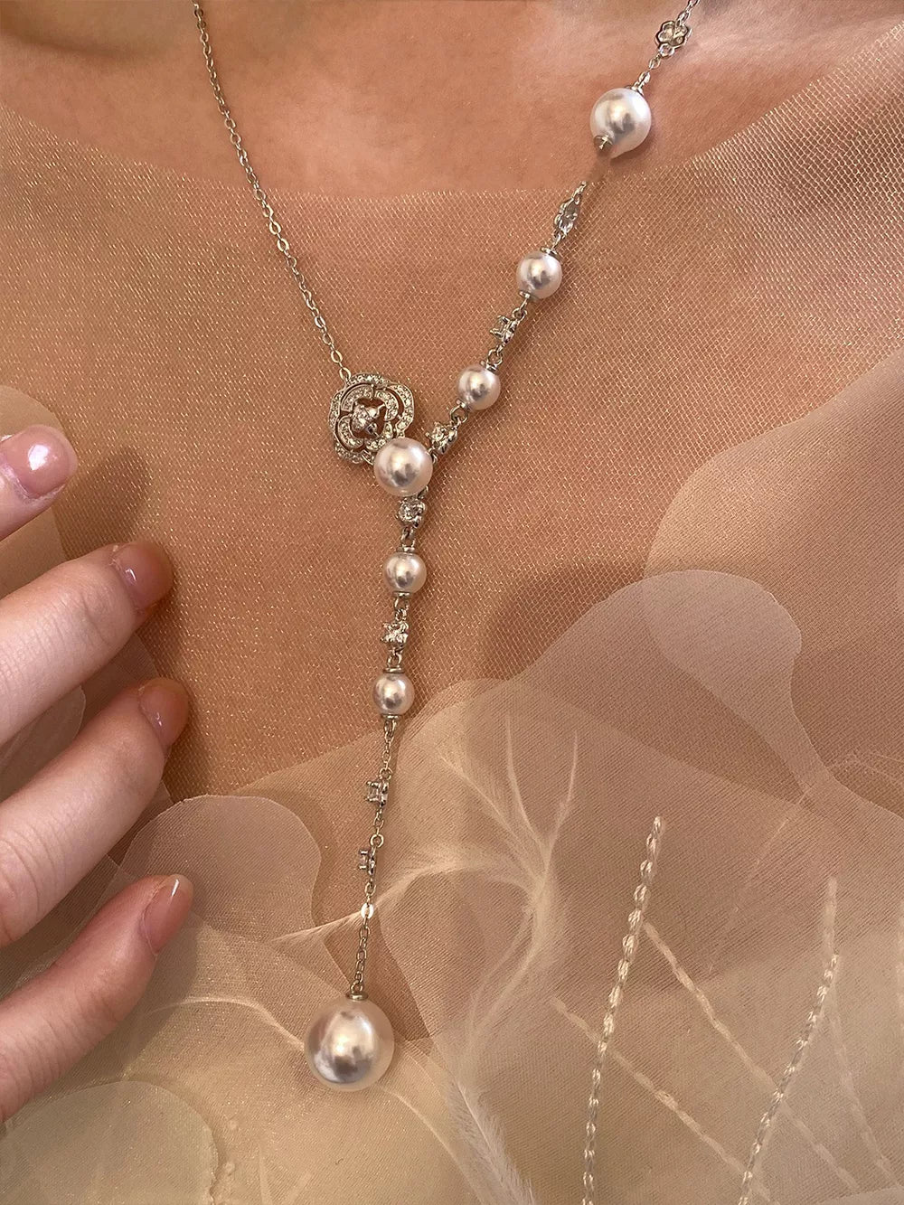 White pearl flower Y-necklace with clear crystal accents and a large pearl drop.