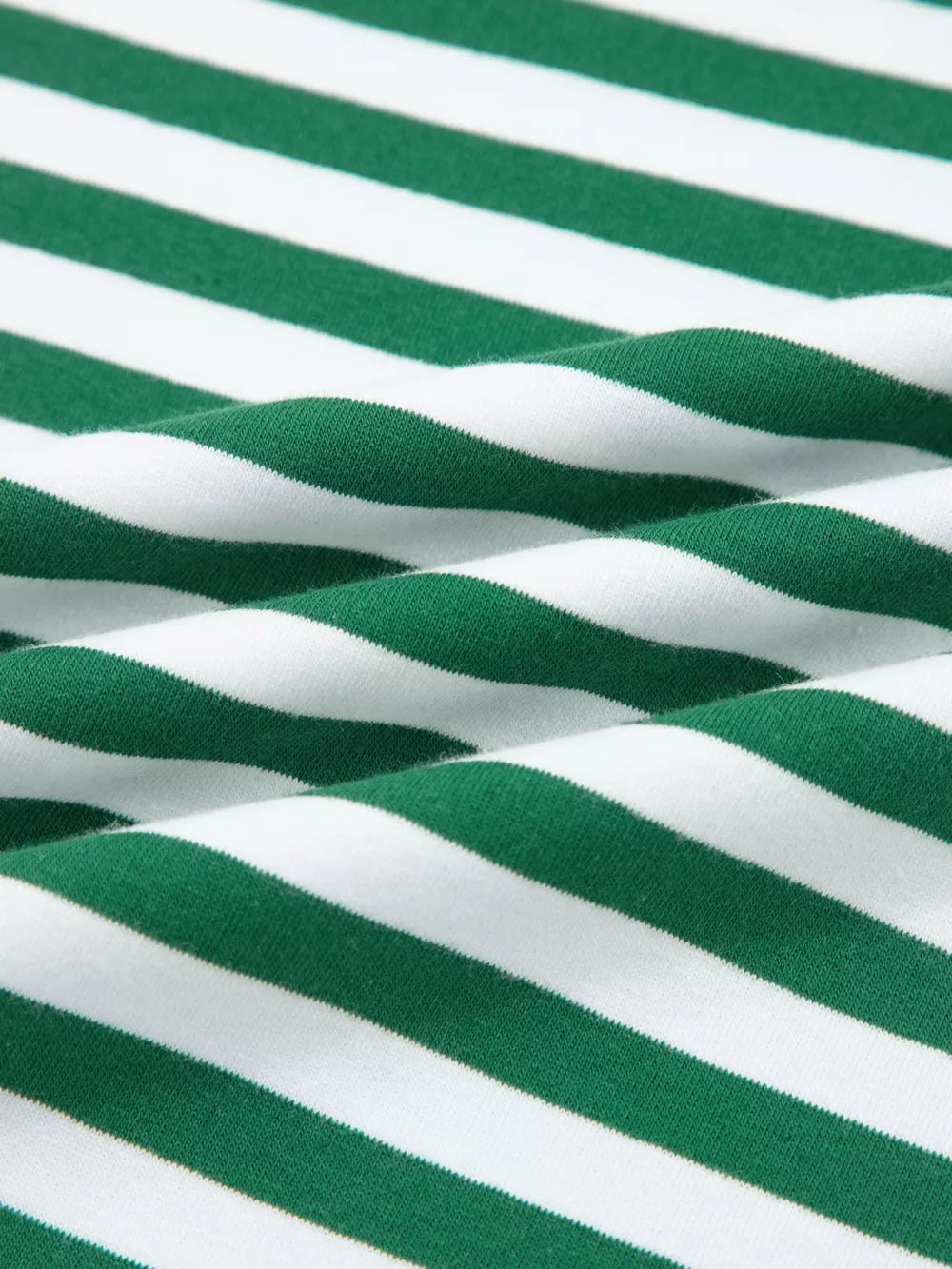 Green and white striped cotton boxy tee and shorts set fabric detail.
