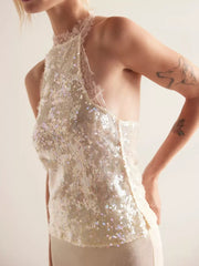 White sequin halter cami with lace trim and a high neckline.