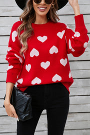 Red acrylic sweater with white heart intarsia pattern, crew neck, long sleeves.