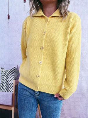 Yellow ribbed cardigan with polo collar and button-up front, styled with jeans.