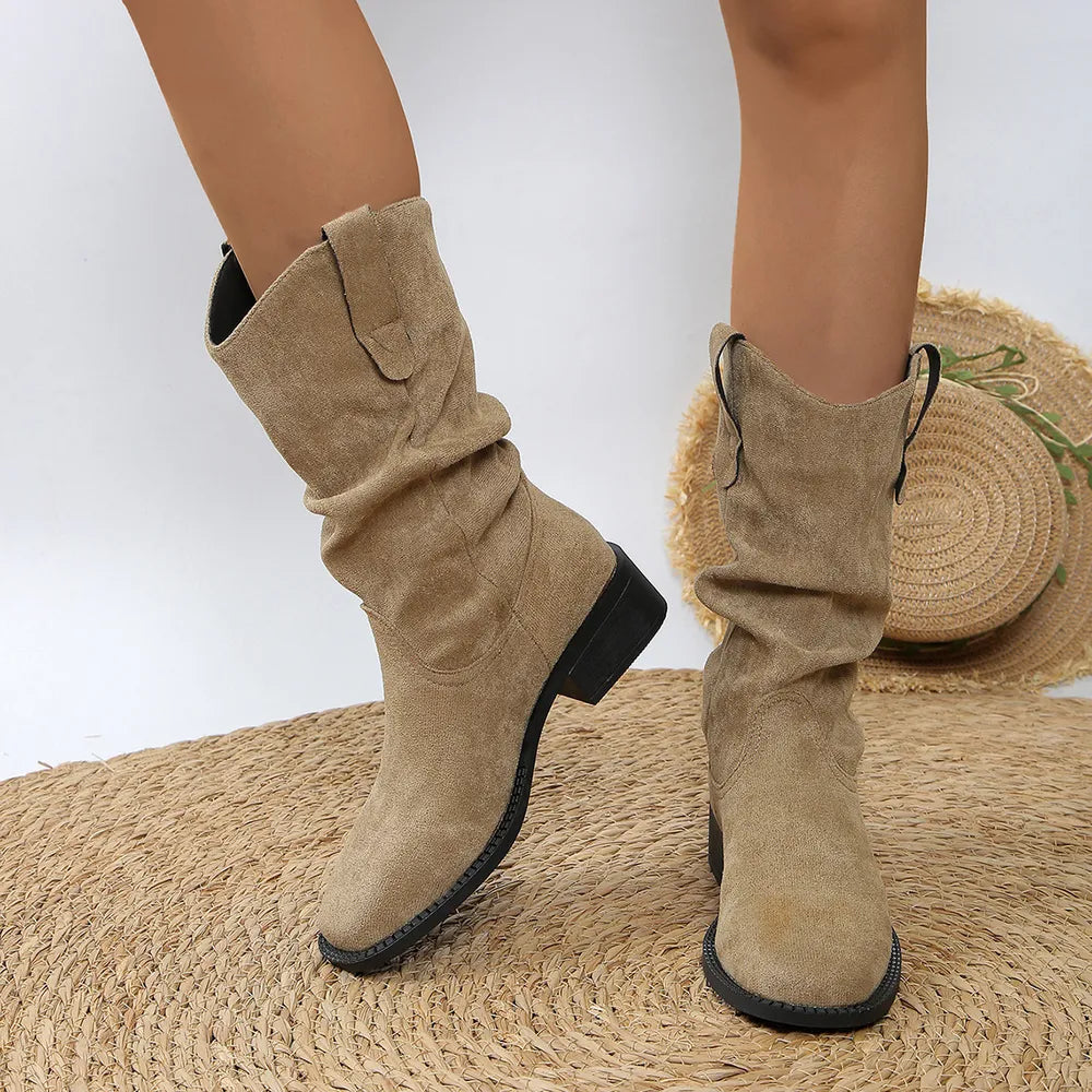 Slouchy khaki ankle boots with a Western-inspired design and block heel.