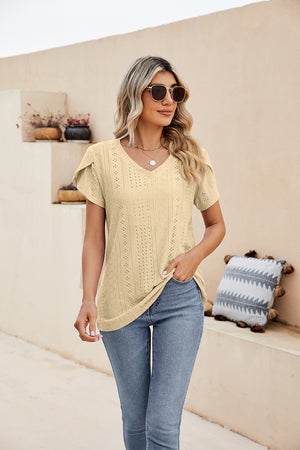 Light yellow knit top with v-neck and perforated sleeve detail