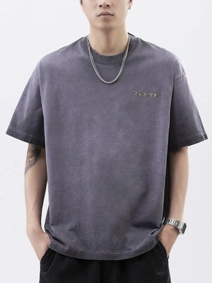 Men's dark gray cotton t-shirt with a subtle letter graphic and round neck.