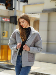 Gray quilted and sherpa panel zip jacket with a stand-up collar.