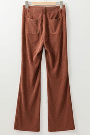 Brown corduroy flared leg trousers with back pockets.
