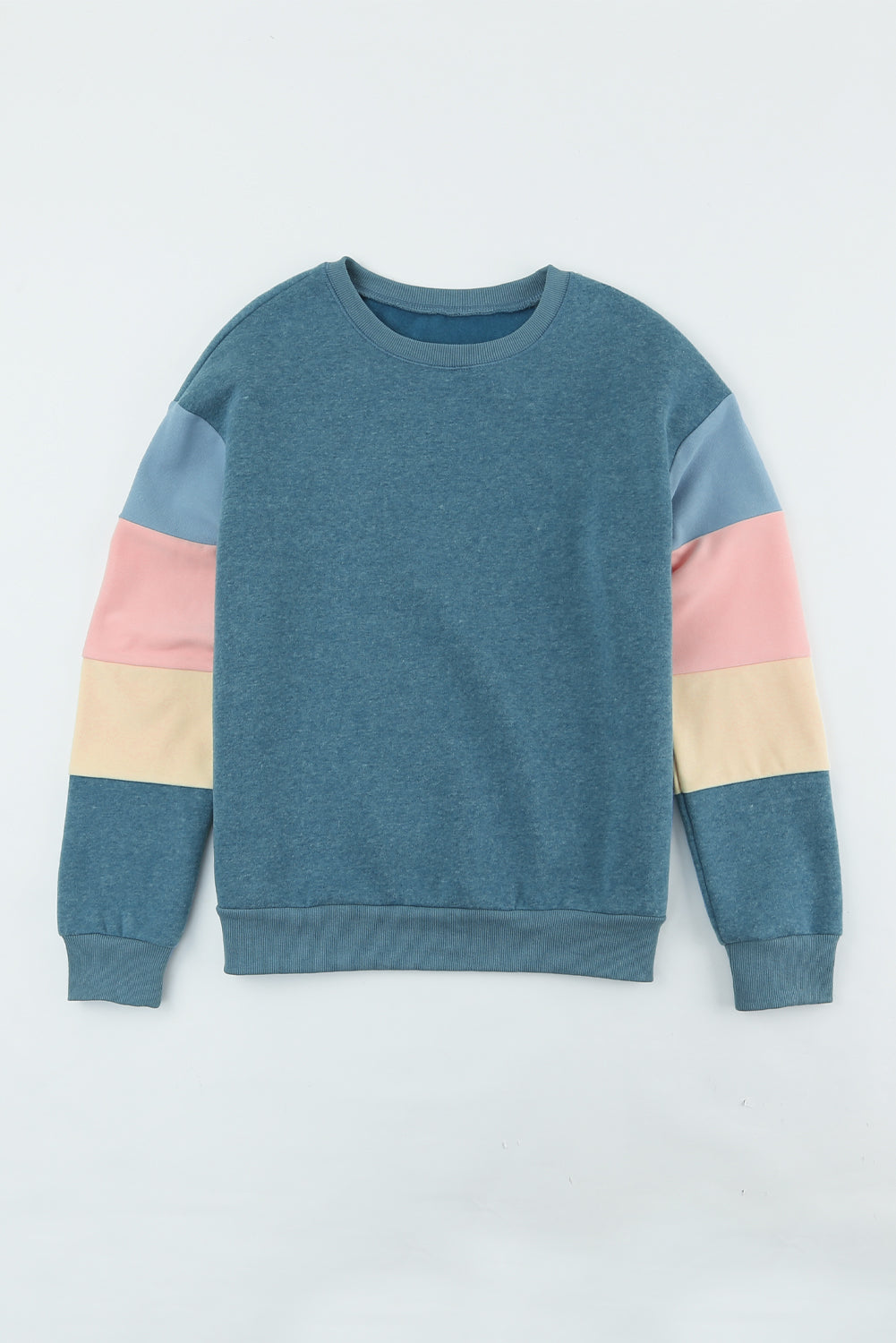 French blue sweatshirt with color block sleeves in pink, cream, and light blue.