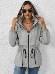Gray hooded utility jacket with cinched waist and drawstring detail