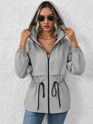 Gray hooded utility jacket with cinched waist and drawstring detail