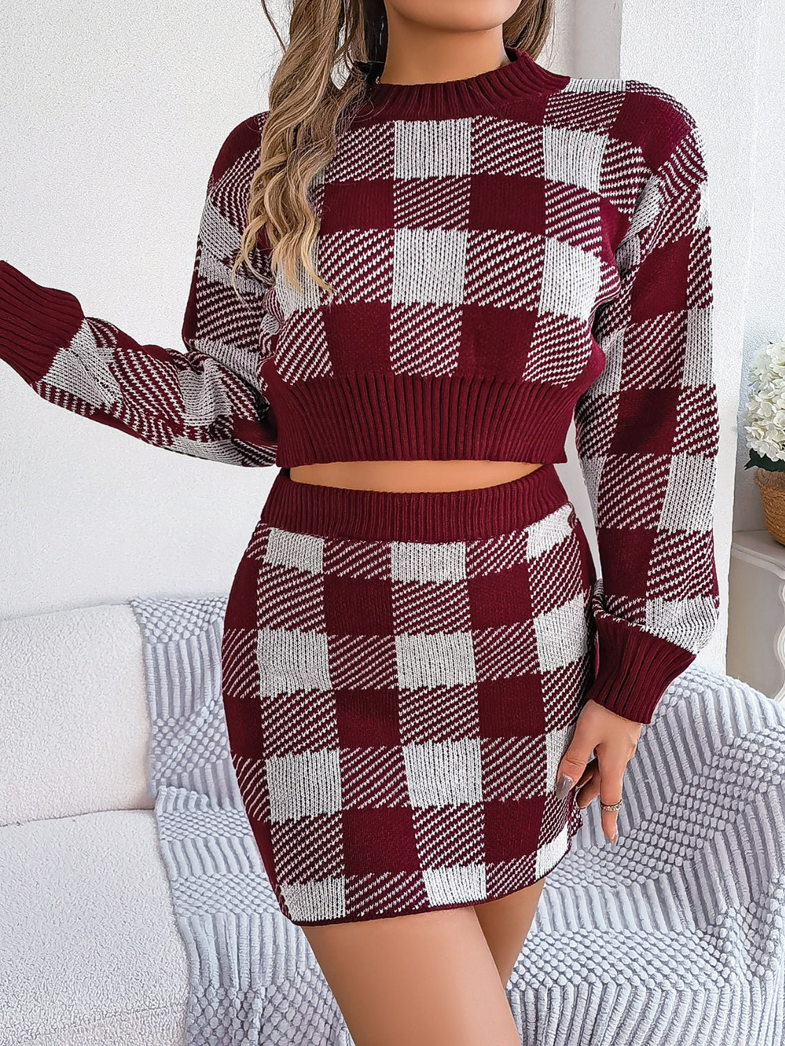 Burgundy checkered knit cropped sweater and mini skirt set with long sleeves.