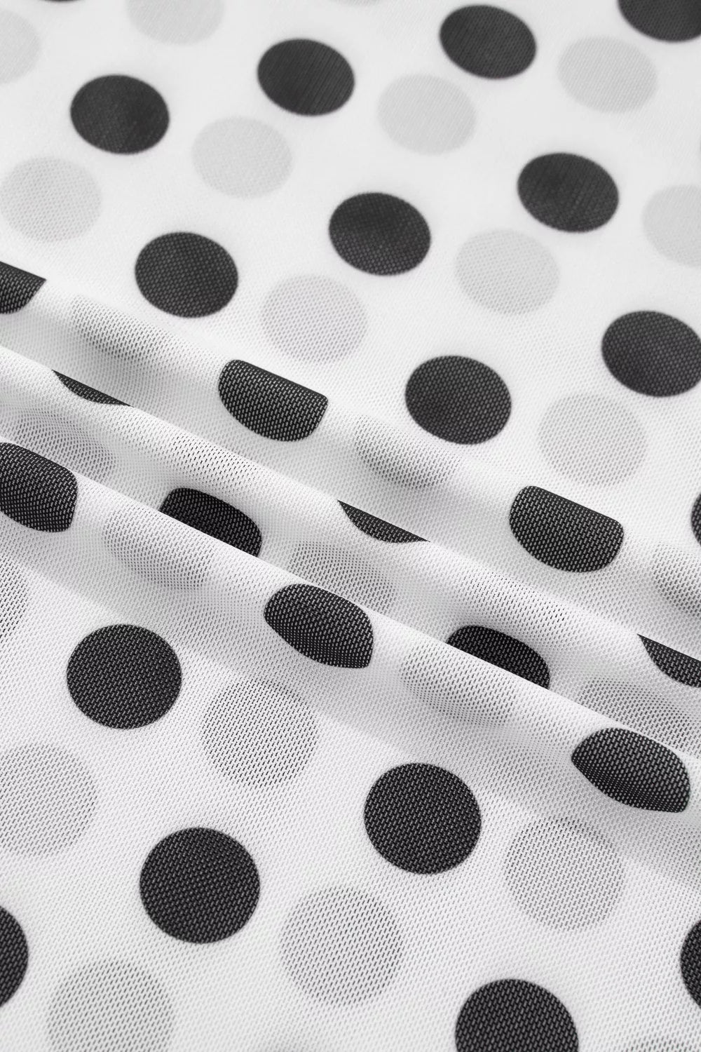 Chic polka dot mesh mock neck shirt in white with black and grey dots, sheer fabric.