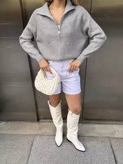 Gray ribbed knit zipper cardigan with a stand-up collar and long sleeves.