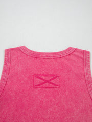 Textured cotton tank top in pink with a V-neck and a decorative X detail on a patch.